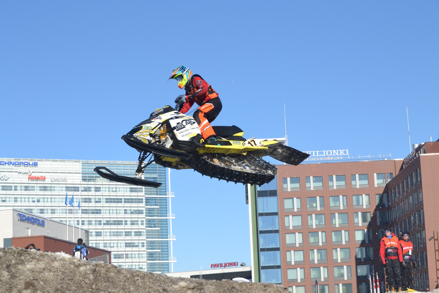 Rider jumping a Ski-Doo snowmobile during a snowcross race